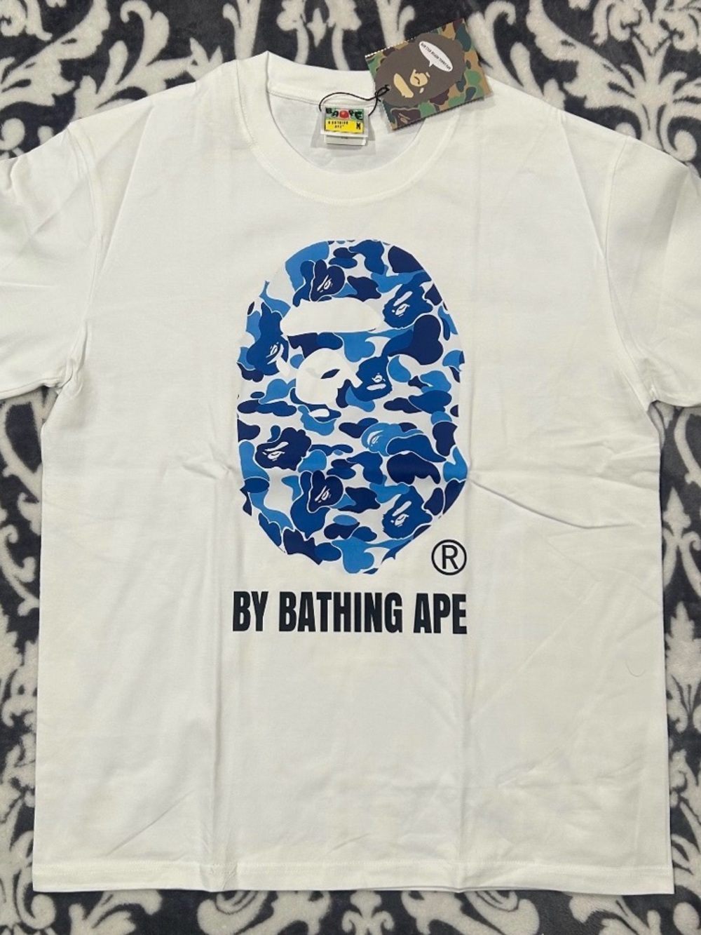 A Bathing Ape White Graphic Tee with Blue Camo Ape Head